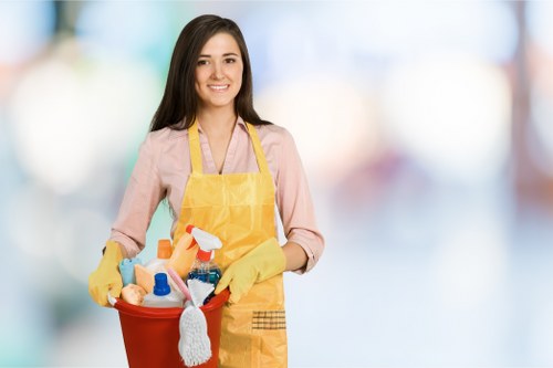 Technician wearing PPE while preparing carpet cleaning equipment